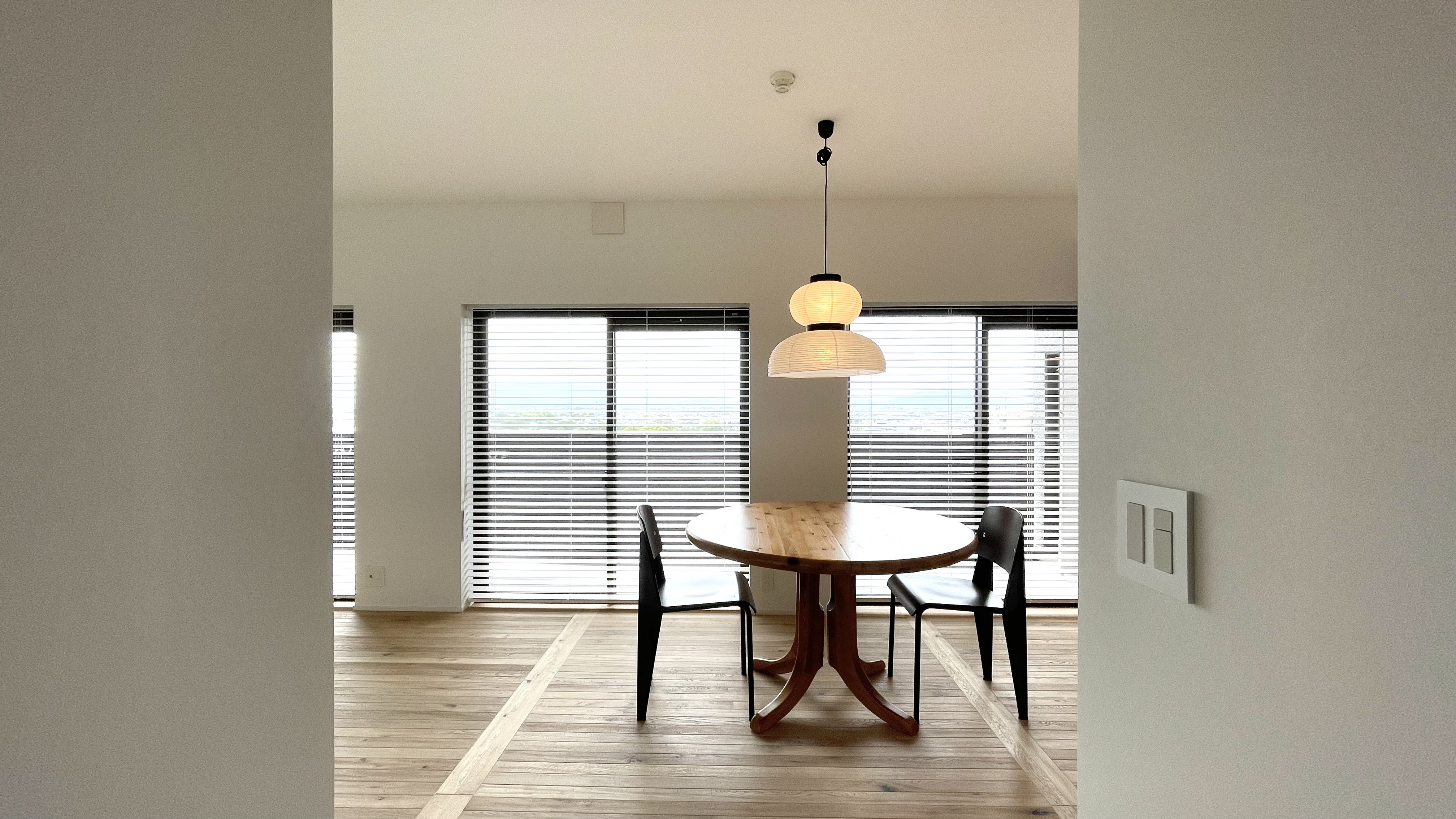 Closer Corridor view of the living room. &Tradition light , Jean Prouvé Chair and Daumiller Table